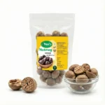 Premium Kerala whole nutmeg seeds on wooden background